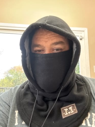 Customer wearing black winter hood